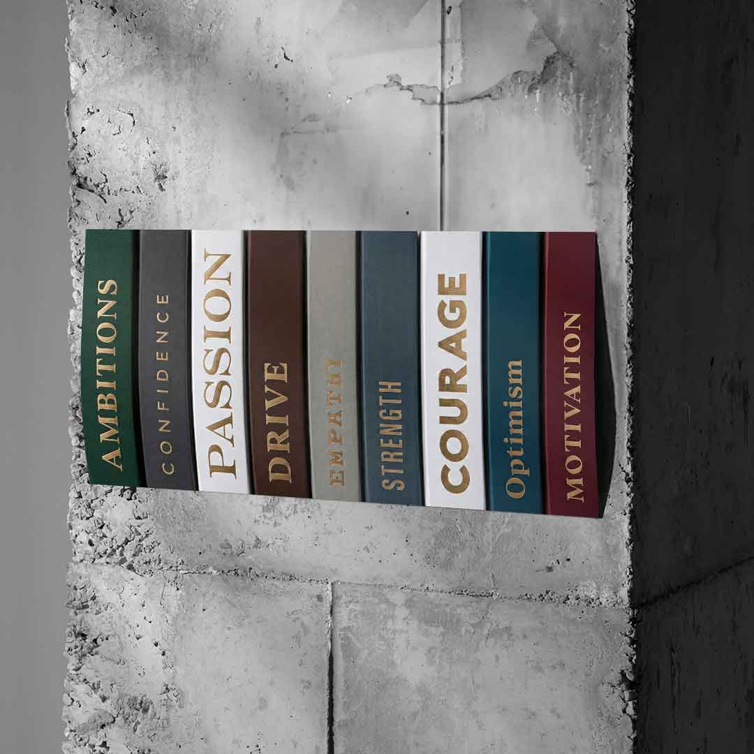 DOTCOMCANVAS Motivational Books Poster auf Betonwand